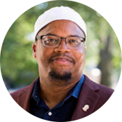 Imam  Khalil Abdur-Rashid, A black man with glasses and a white cap