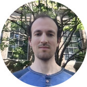 Balding brunette man wearing a blue shirt